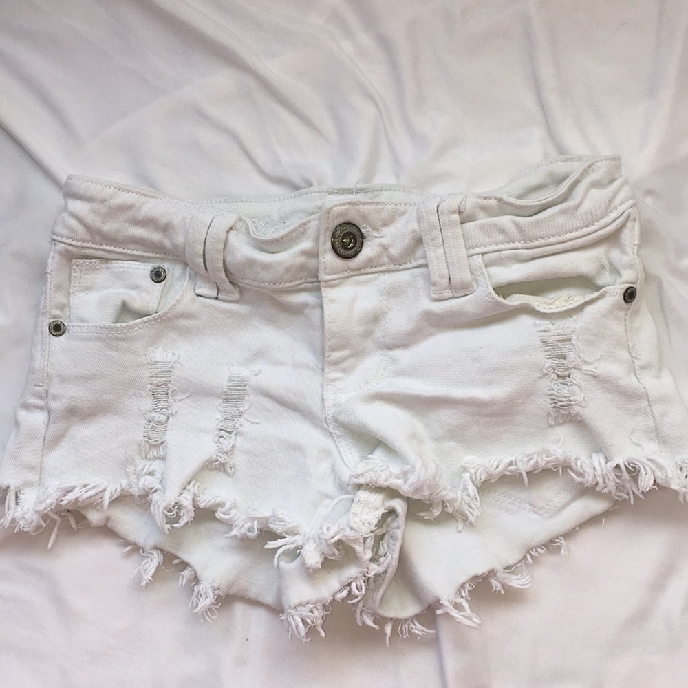 White ripped denim shorts